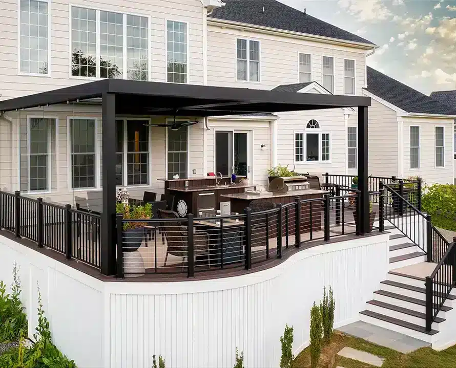 Pergola in Deck Ideas - Photo of a custom deck with a pergola and outdoor living room - Custom Deck Builders in New Jersey