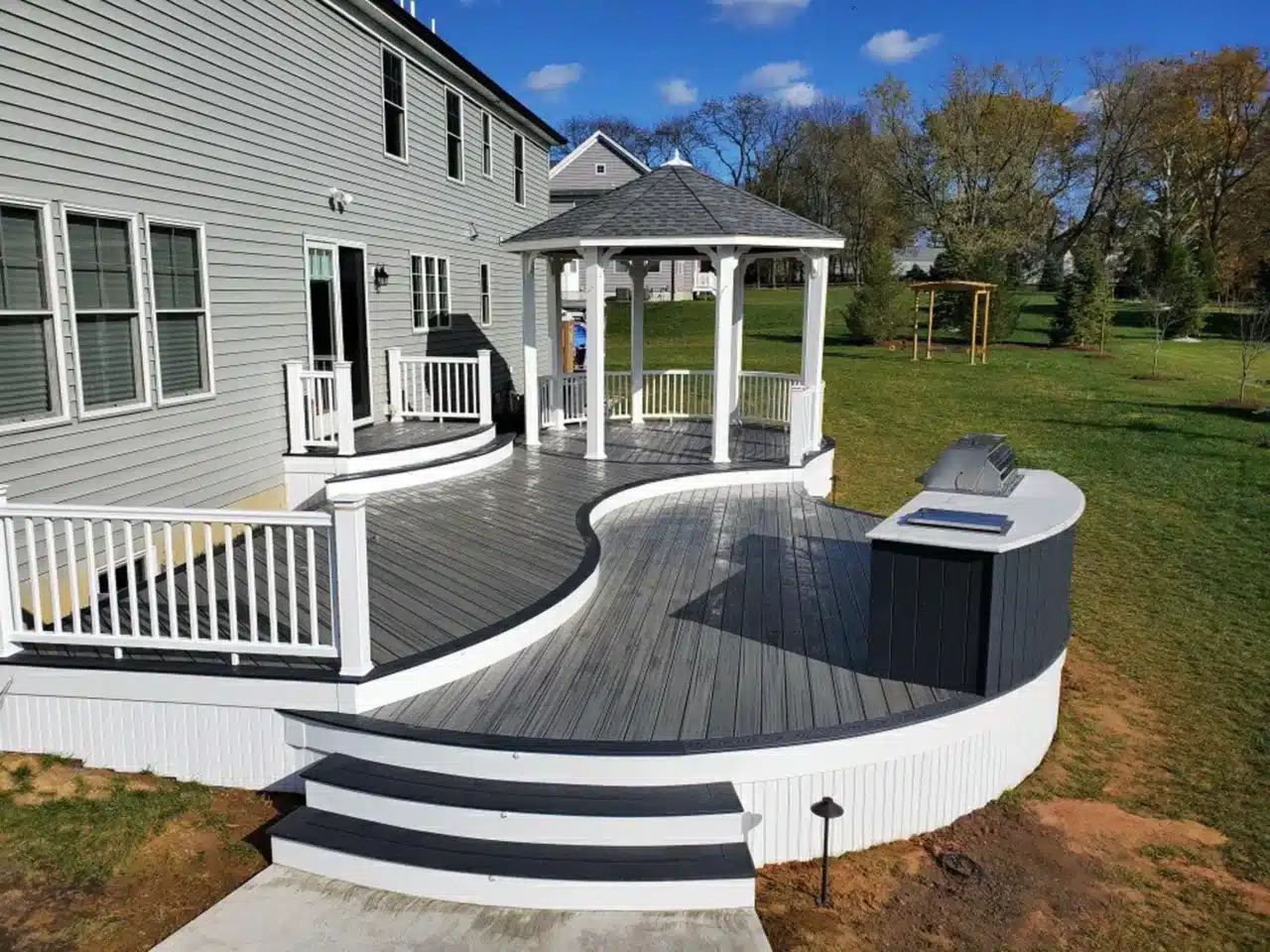 Curved deck ideas - Photo of curved deck with flowing lines and gazebo - Curved Deck Builders in New Jersey