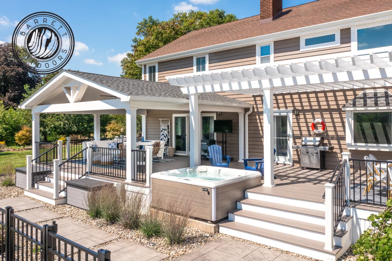 Photo of a white pergola providing shade to a custom composite deck