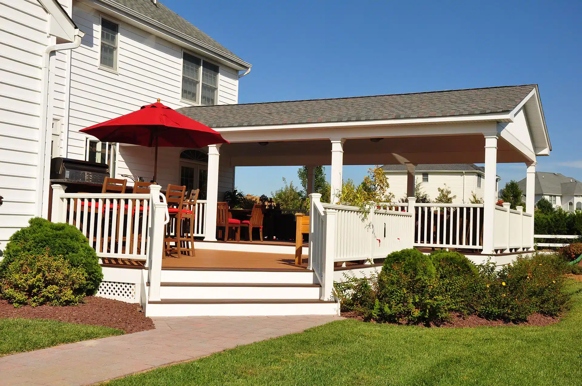 Photo of deck with Pavilion and grill station and bar