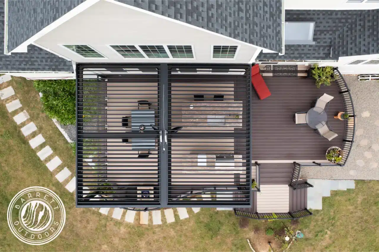 Aerial view of a pergola providing shade to a custom deck for a post about different types of pergolas and shade structures