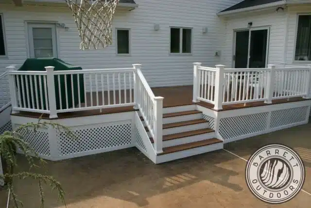 raised deck with deck railing, deck steps, and lattice deck skirting